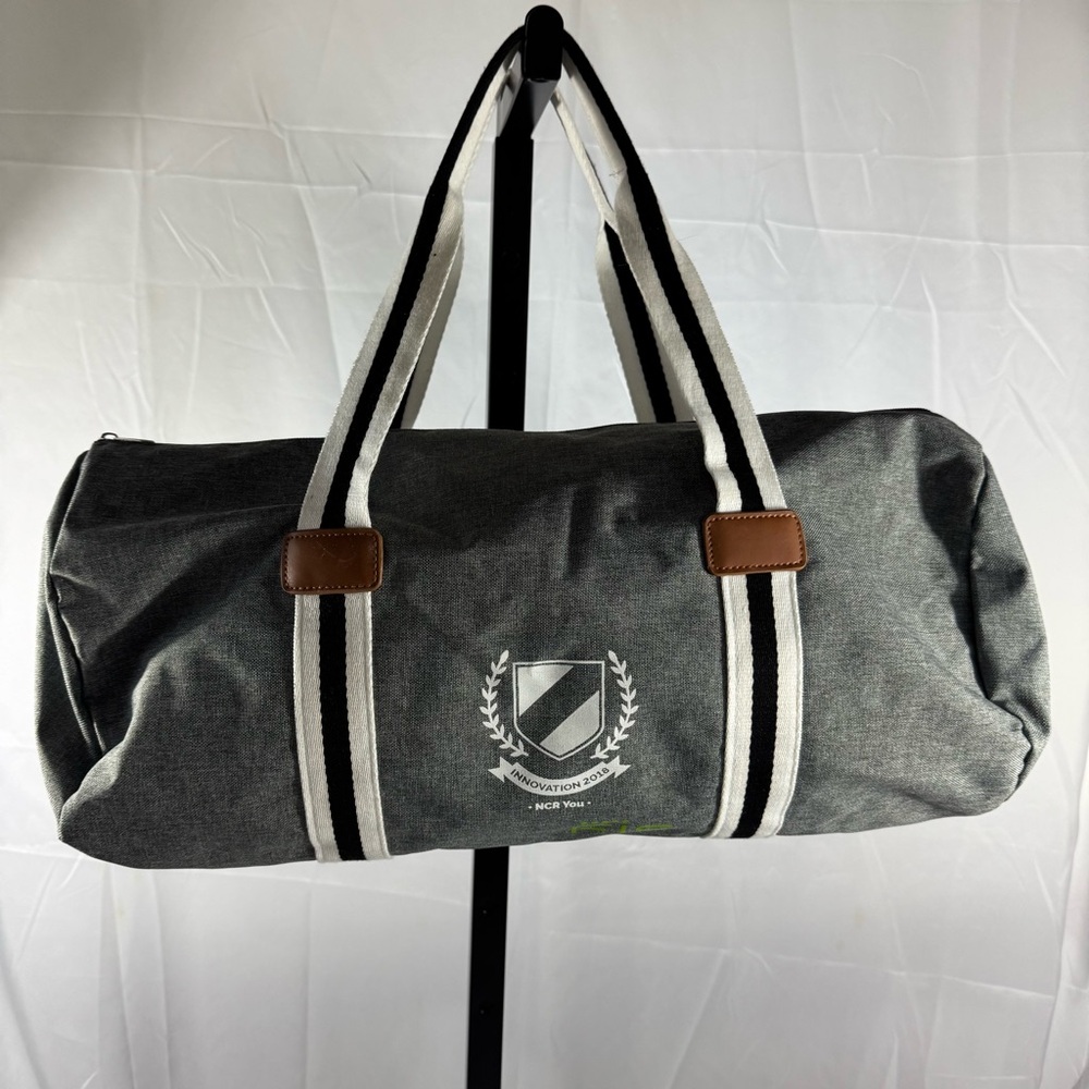 62. Classic Gray Duffel Bag with Black and White Straps